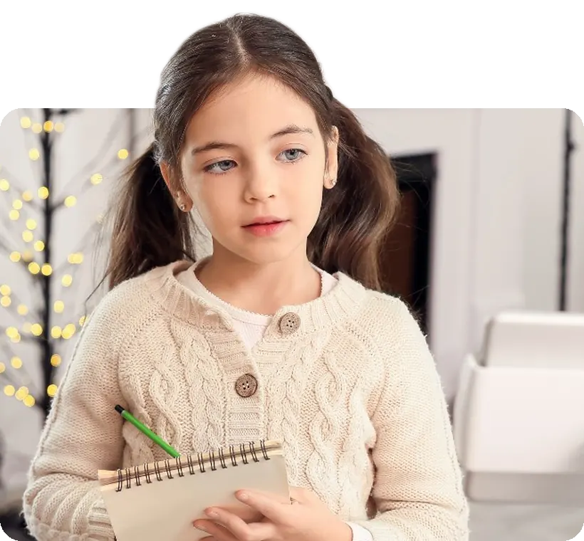A student with her practice notebook by the keyboard.