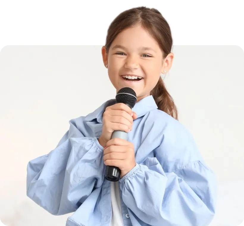 A proud young singer with her microphone.